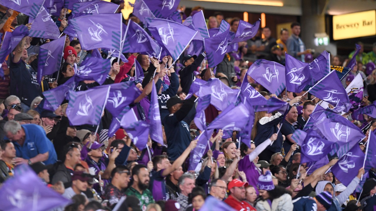 Melbourne Storm fans wearing storm jerseys and merch